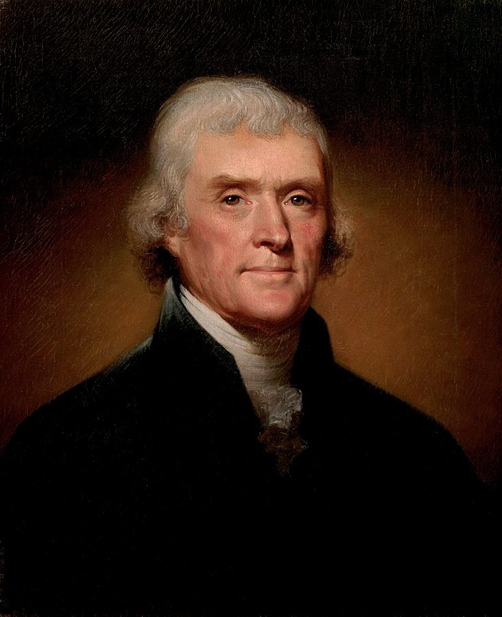 A painting of Thomas Jefferson with a serious but friendly expression. He has white hair and wears a dark overcoat that shows off a ruffled, white shirt collar.