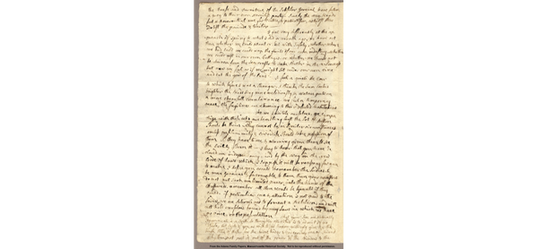 Image of a full-page letter written in flowy cursive on yellowing paper.