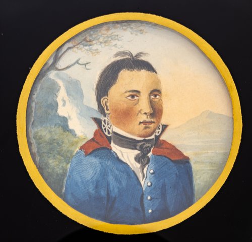 A round-shaped painting of an Indigenous man dressed in a colonial White man's clothing. He has a serious expression. The background shows a tree, mountains, waterfall, and lake.