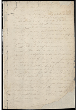 n image of a torn historic document with faded cursive script.